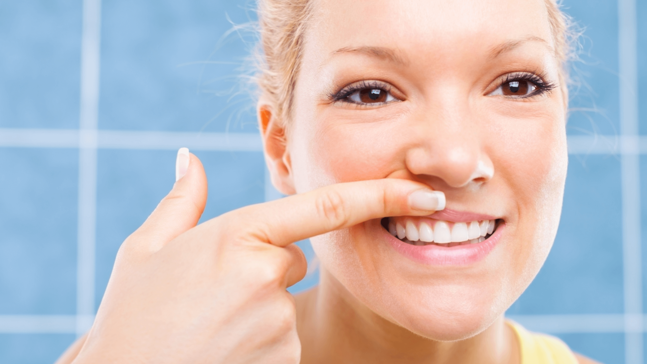 woman looking at her teeth